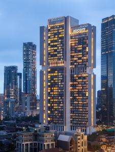 a city with tall buildings and a sky background at Ascott Sudirman Jakarta in Jakarta