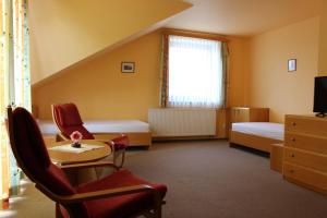 Postel nebo postele na pokoji v ubytování Motel U Krbu
