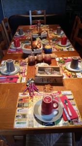 a wooden table with food on top of it at Chambres d'Hôtes Larrey in Audignon