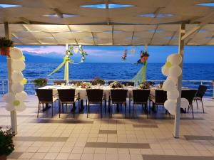 a table set up for a wedding on the beach at Hotel Millennium in Pogradec