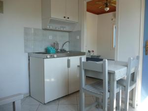Кухня или кухненски бокс в Armonia Apartments
