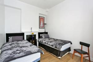 En eller flere senge i et værelse på Aspect Apartments City Centre