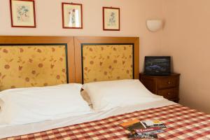 Posteľ alebo postele v izbe v ubytovaní Hotel Il Giardino