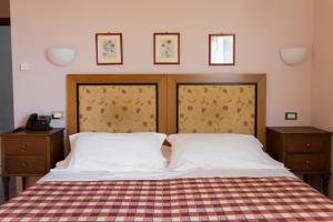 Posteľ alebo postele v izbe v ubytovaní Hotel Il Giardino