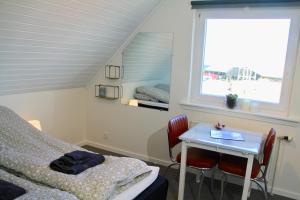 Postel nebo postele na pokoji v ubytování Nordic Inn Thorshavn
