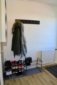 a person standing in a room with a closet full of clothes at Nordic Inn Thorshavn in Tórshavn