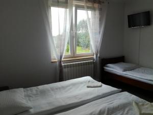 Postel nebo postele na pokoji v ubytování Centrum Turystyki Wiejskiej Alicja
