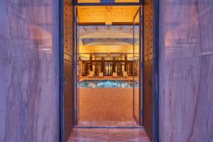 a view of a swimming pool through a doorway at Hotel Porto Santo & Spa in Porto Santo