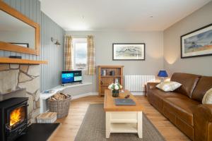 Μια τηλεόραση ή/και κέντρο ψυχαγωγίας στο Highland Holiday Cottages
