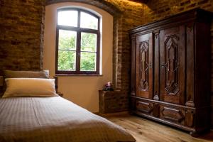 Кровать или кровати в номере Wirgarten Antik Hotel