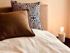 Säng eller sängar i ett rum på Appartement Seaview Bunnenplein