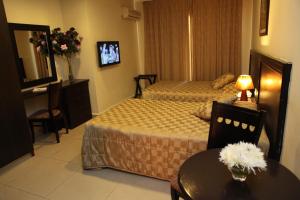 Letto o letti in una camera di Mozart Hotel