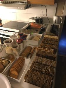a bunch of food on a counter in a kitchen at Norrgården i Sandviken in Sandviken