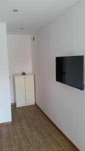 A television and/or entertainment centre at Banya Guest Rooms 23