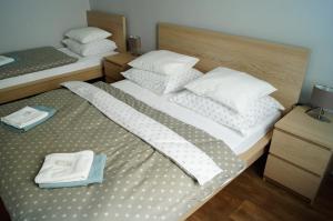 Postel nebo postele na pokoji v ubytování Apartmány Mary