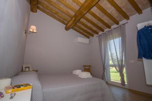 Posteľ alebo postele v izbe v ubytovaní Agriturismo Il Mirto