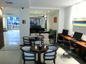 Uma área de estar em Villaggio Hotel Boutique