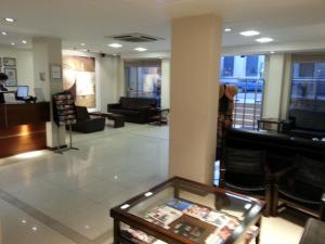 Uma TV ou centro de entretenimento em Villaggio Hotel Boutique