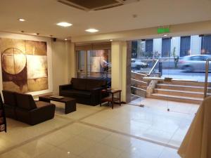 Uma área de estar em Villaggio Hotel Boutique
