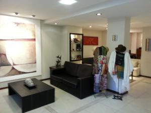 Uma área de estar em Villaggio Hotel Boutique