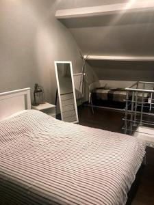 Кровать или кровати в номере Le Poule House