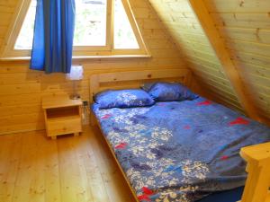 Ένα ή περισσότερα κρεβάτια σε δωμάτιο στο Sławska Poręba