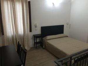 Voodi või voodid majutusasutuse Decadracma rooms toas