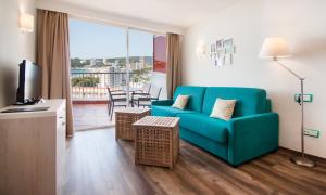 a living room filled with furniture and a window at Apartamentos Vistasol in Magaluf