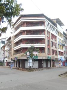 an apartment building on the corner of a street at Hotel Arcadia in Panaji