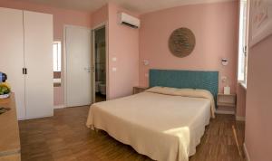Postel nebo postele na pokoji v ubytování Ai Pesci Room Rental