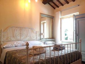 A bed or beds in a room at La Corte
