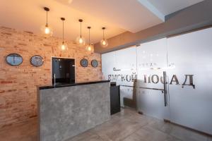 a reception area of a hospital with a brick wall at Yamskoy Posad in Kazan