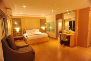 Ένα ή περισσότερα κρεβάτια σε δωμάτιο στο Kitlada Hotel Udonthani