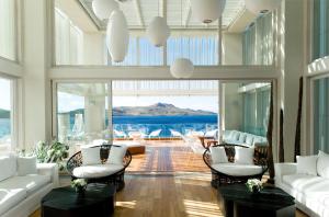 a living room with white furniture and a large window at Palmalife Bodrum Resort & Spa in Yalıkavak