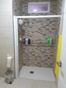 a shower with a glass door in a bathroom at Alojamiento Cádiz in Cádiz