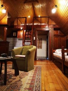 a living room with a couch and a bunk bed at Apartments DM in Mokra Gora