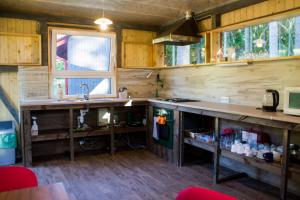 a kitchen with a sink and a counter top at Kempings Ozolkalns in Cēsis