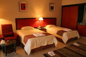 A bed or beds in a room at Rehana Royal Beach Resort - Aquapark & Spa - Family & Couples Only - Premium Ultra All-Inclusive 24H
