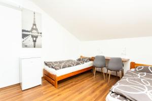 A bed or beds in a room at Pohoda Ubytovanie Stupava