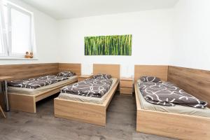 A bed or beds in a room at Pohoda Ubytovanie Stupava