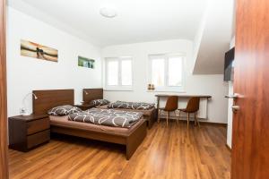 A bed or beds in a room at Pohoda Ubytovanie Stupava