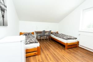 A bed or beds in a room at Pohoda Ubytovanie Stupava