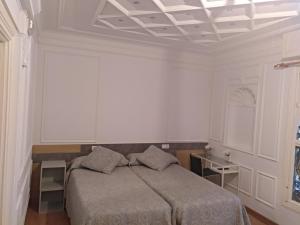 Postel nebo postele na pokoji v ubytování Hostal Rioja Condestable