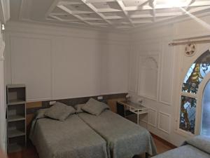 Postel nebo postele na pokoji v ubytování Hostal Rioja Condestable