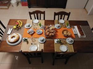 a wooden table with food on top of it at Casa Castellano in Nola