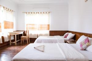 Postel nebo postele na pokoji v ubytování Ananda Tree House Eco Homestay