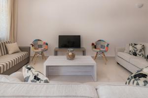 TV a/nebo společenská místnost v ubytování Luna Apartments