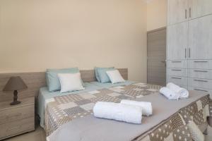 Postel nebo postele na pokoji v ubytování Luna Apartments