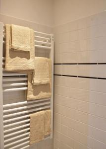 a bathroom with towels hanging on a towel rack at Agave Room Rental in Riomaggiore +37 photos