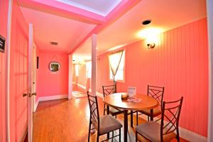 a dining room with a table and chairs at Historic Apartment in the Heart of Christiansted in Christiansted